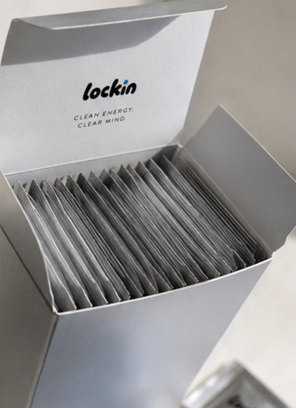 Open box showing thirty sealed foil sachets