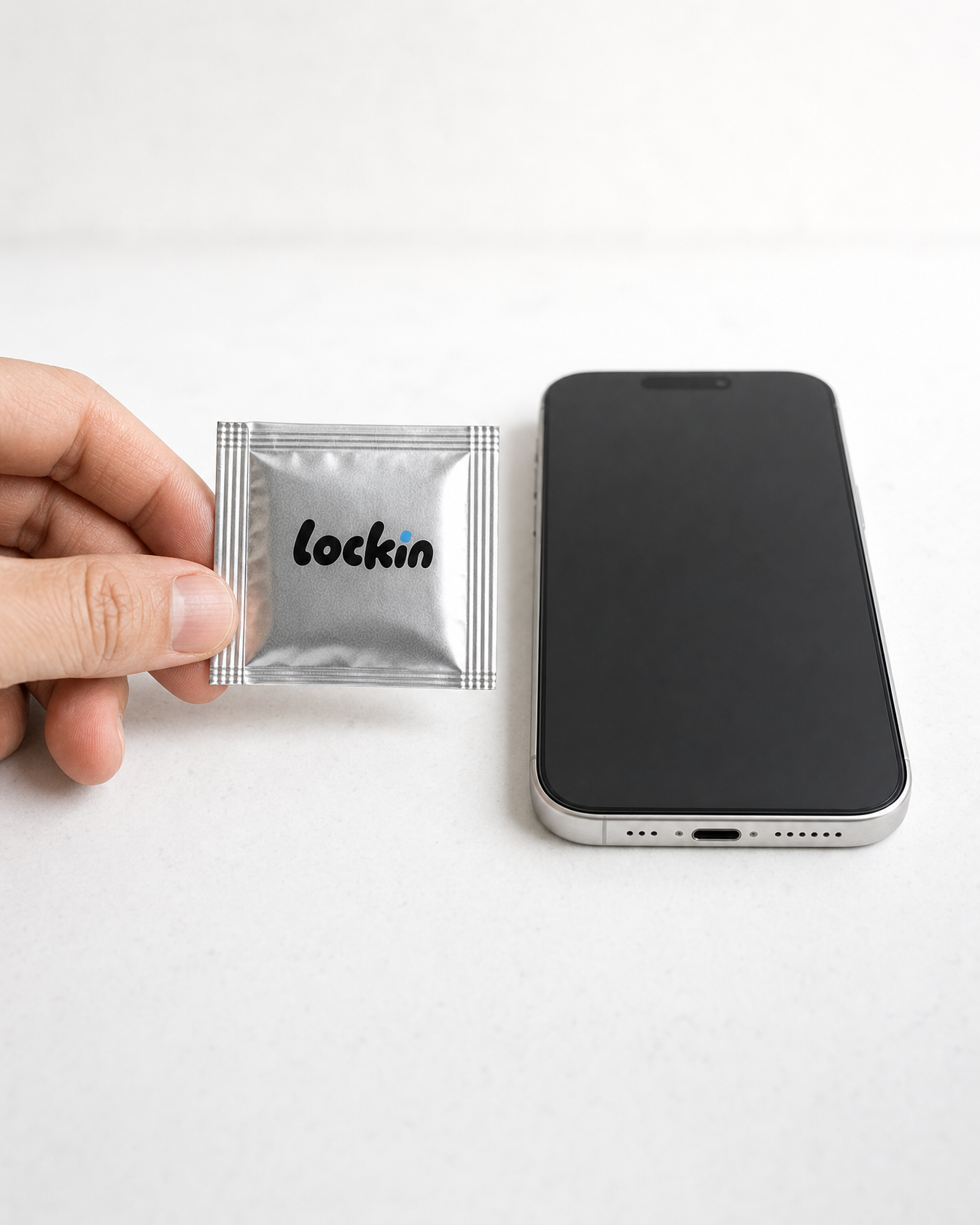 One foil held between two fingers, showing how small a daily dose is